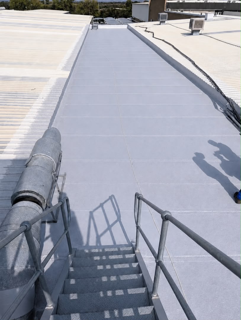 Torch-on waterproofing membrane being applied to a commercial roof slab during application